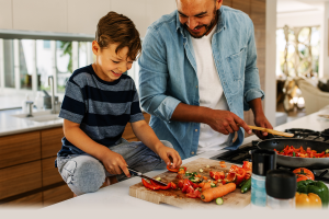 a father and son preparing a nutritious meal