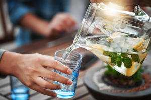 Pouring water into a glass at Symmetry Health Center